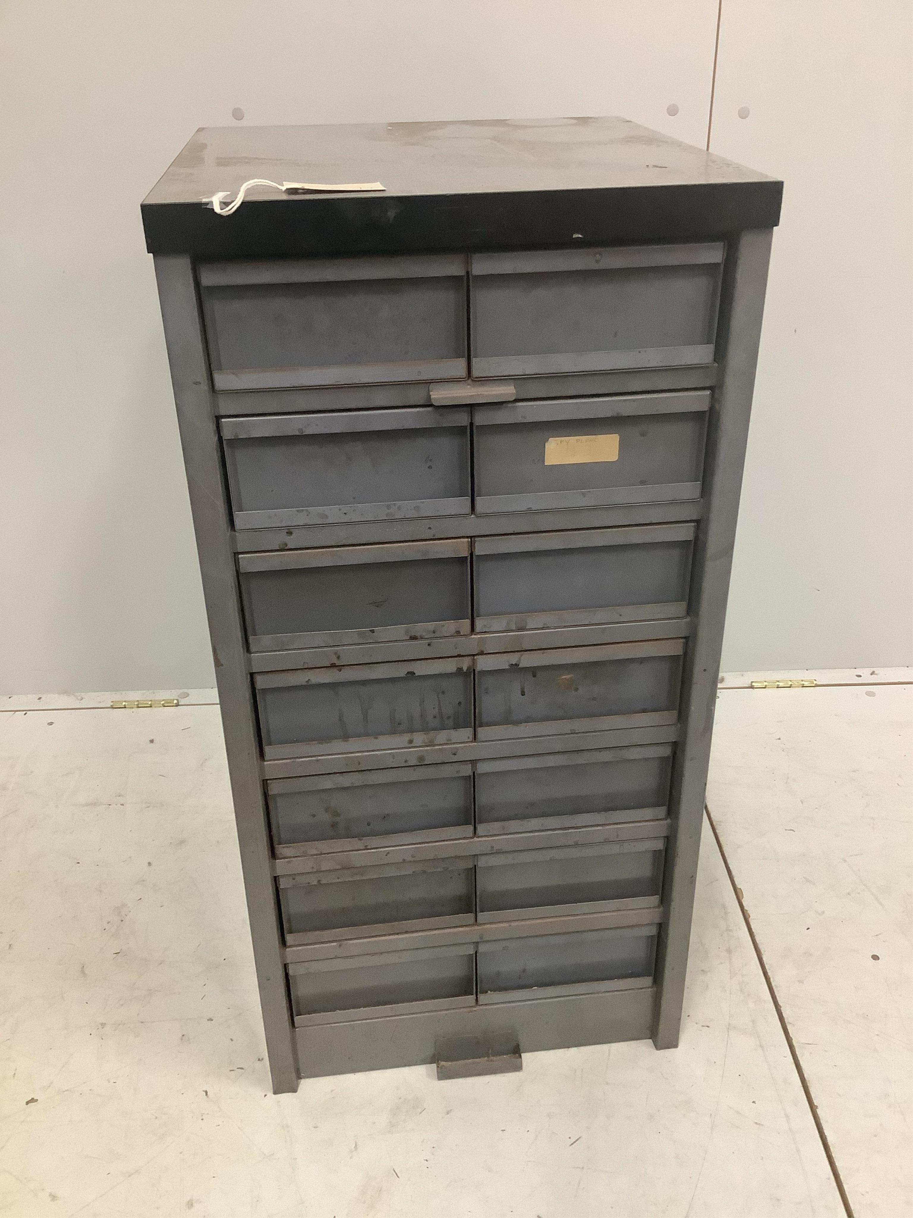 An industrial metal fourteen drawer tall chest, width 45cm, depth 48cm, height 92cm. Condition - fair